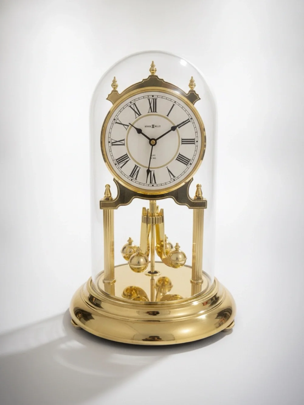 Vintage Howard Miller brass mantle clock with glass dome and pendulum Working